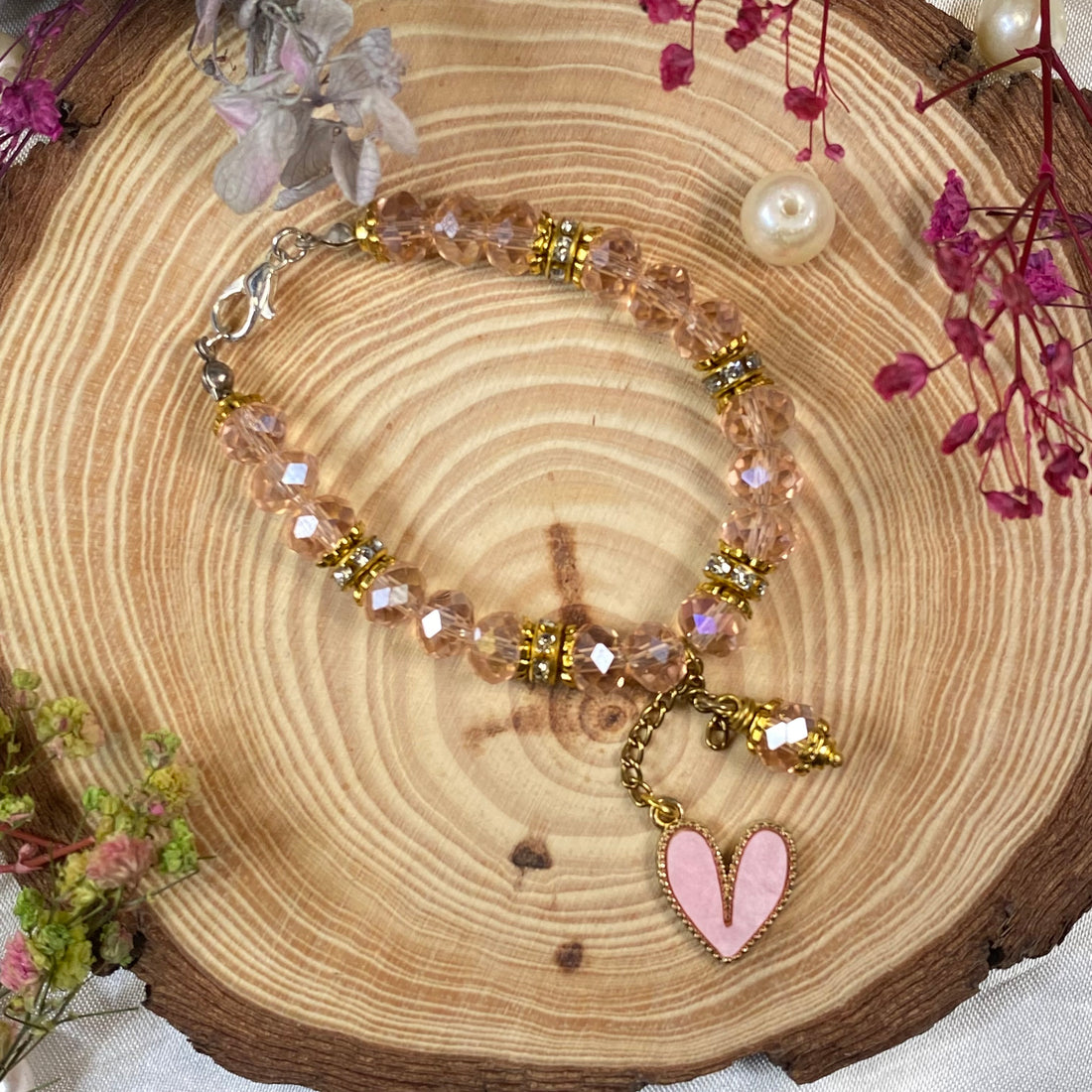 Crystal bead bracelets with heart charms in golden accent