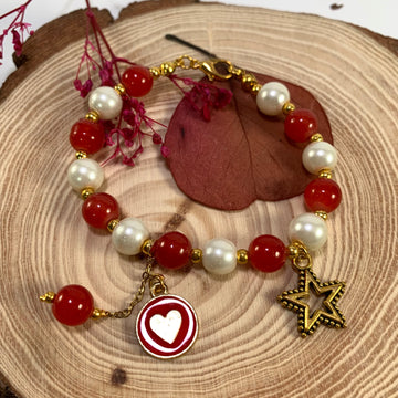 White and red jelly beads bracelet with charms