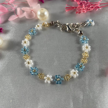 Daisy Flowers bracelet, made with Sea blue, white and Golden Seed beads Finishing