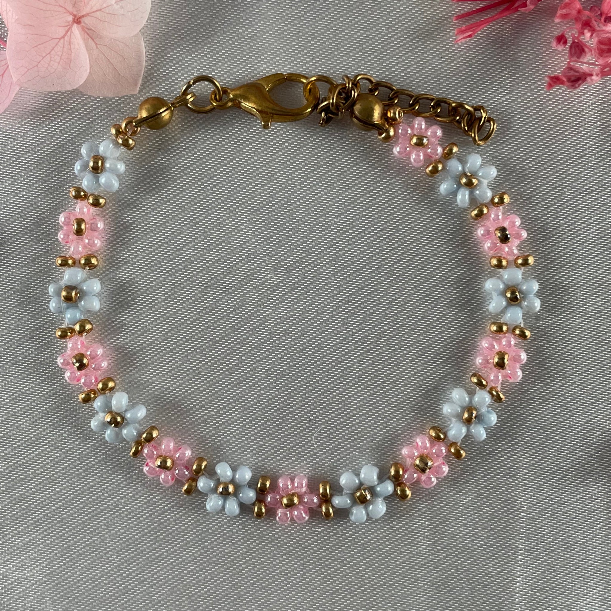 Daisy Flowers bracelet, made with Rose Pink and pastel blue Colour, Golden bead finishing