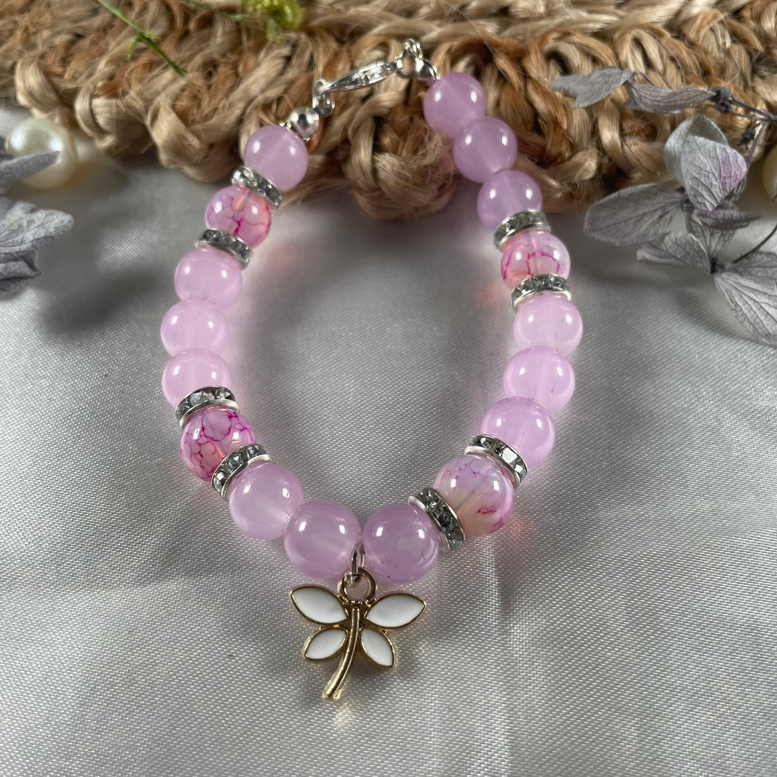 Premium baby pink and marble bead bracelet with butterfly charm