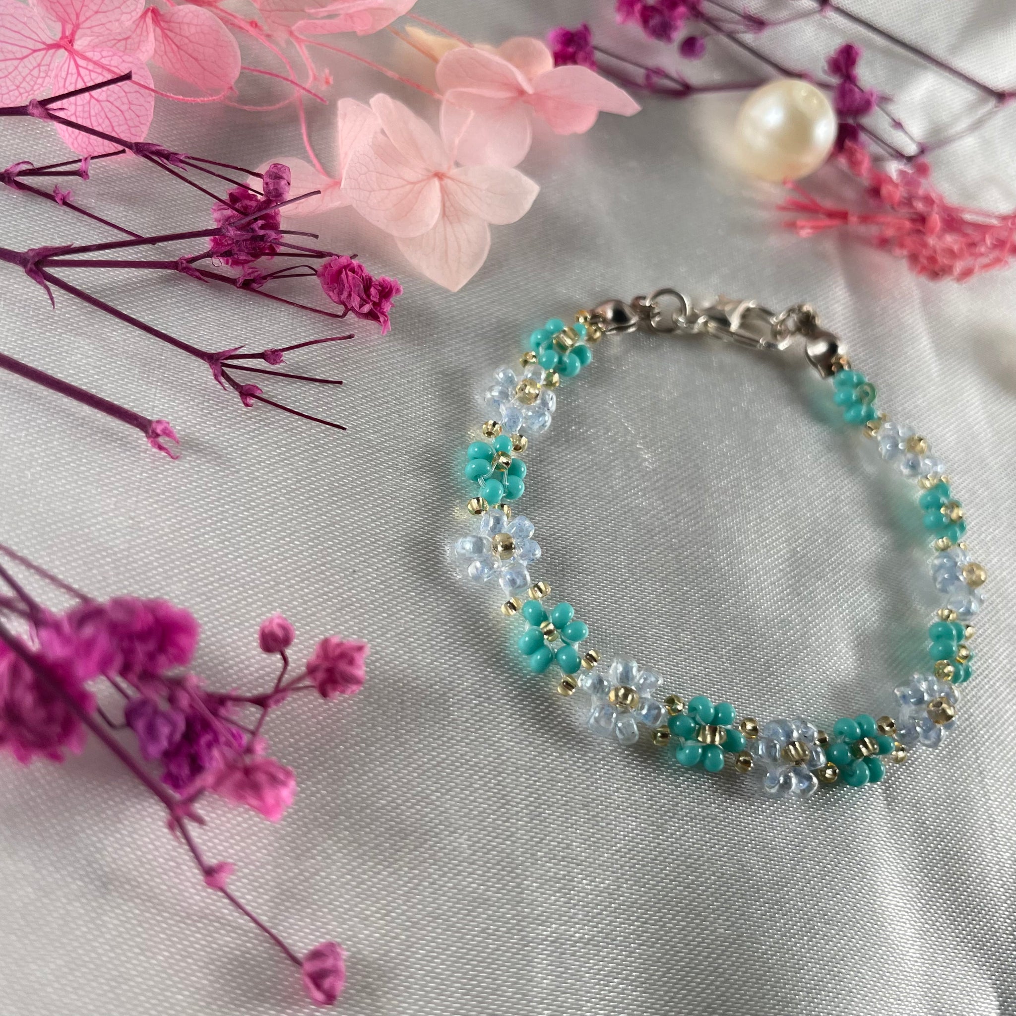 Daisy Flowers bracelet, made with pastel Blue Tail Green, beads