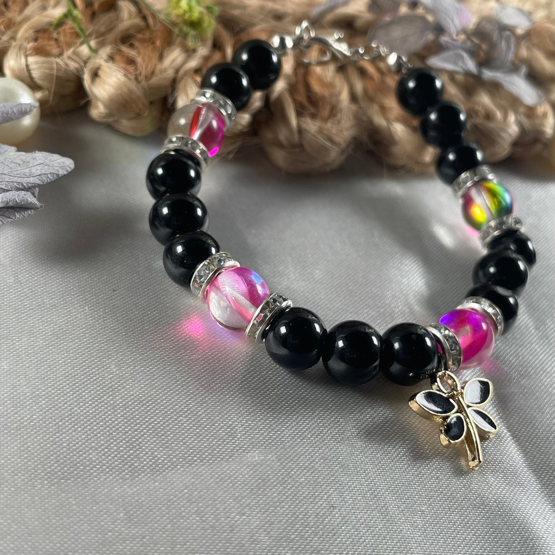 Premium aura and black jelly bead bracelet with charm