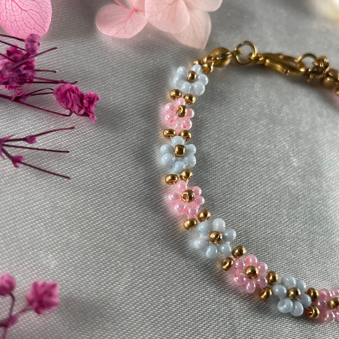 Daisy Flowers bracelet, made with Rose Pink and pastel blue Colour, Golden bead finishing