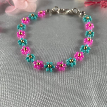 Daisy Flowers bracelet, made with colour Pink and Tail Green seed beads with Golden beads finishing