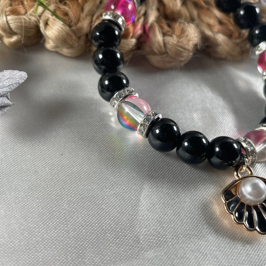 Premium aura and black jelly bead bracelet with shell charm